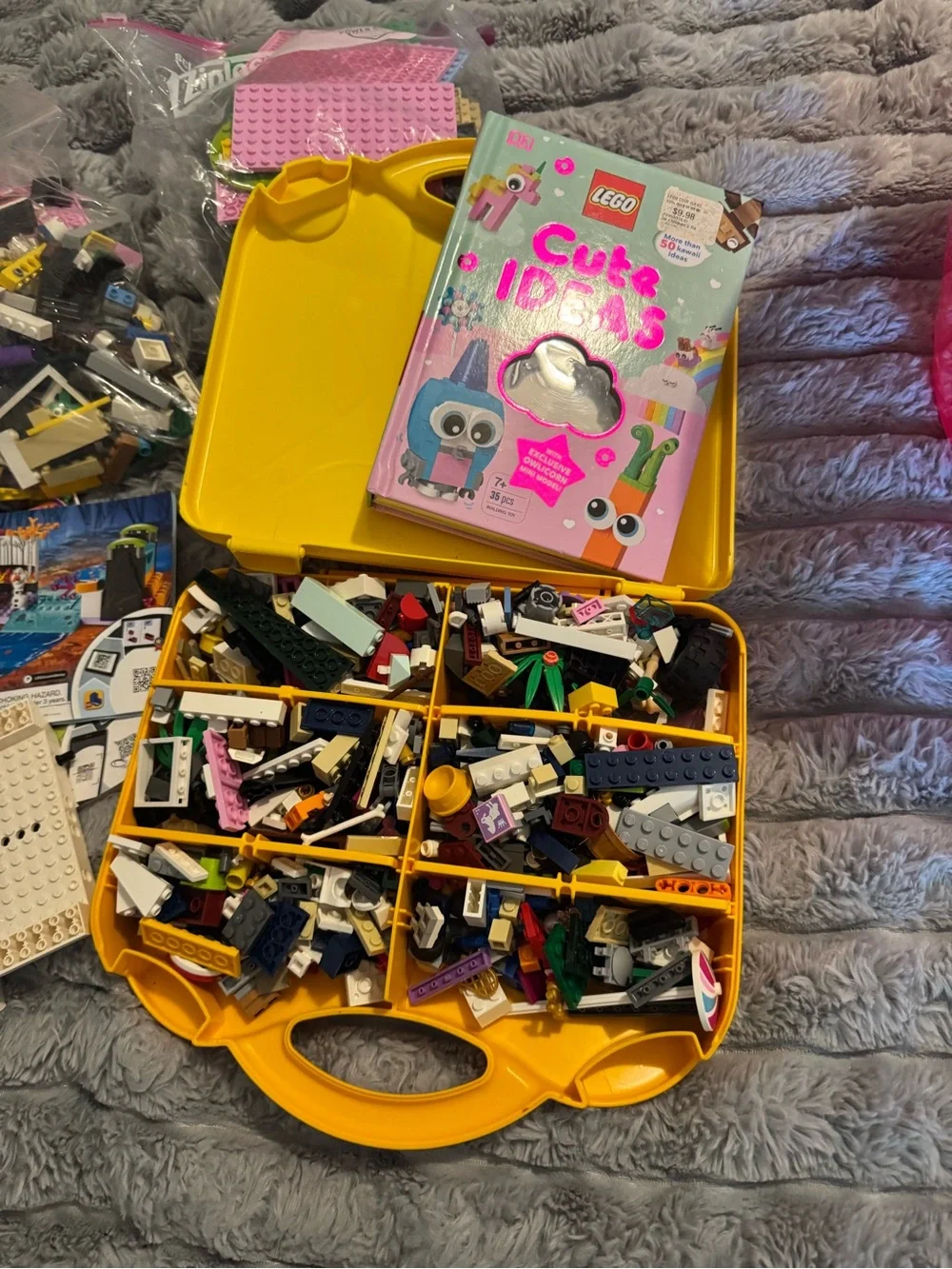 Lego Yellow and Orange Carry Cases filled with Lego bricks and a bag of boards